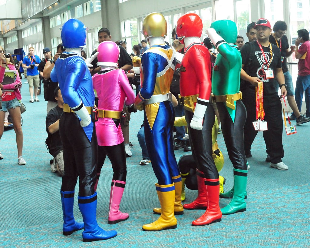 Group of people cosplaying as Power Rangers