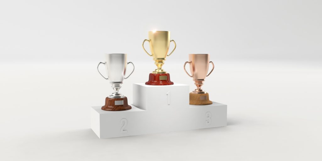 Gold, silver, and bronze trophies.