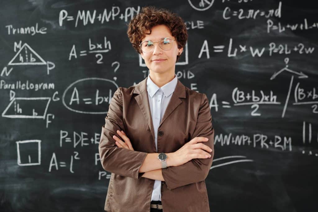 Smart woman in front of blackboard