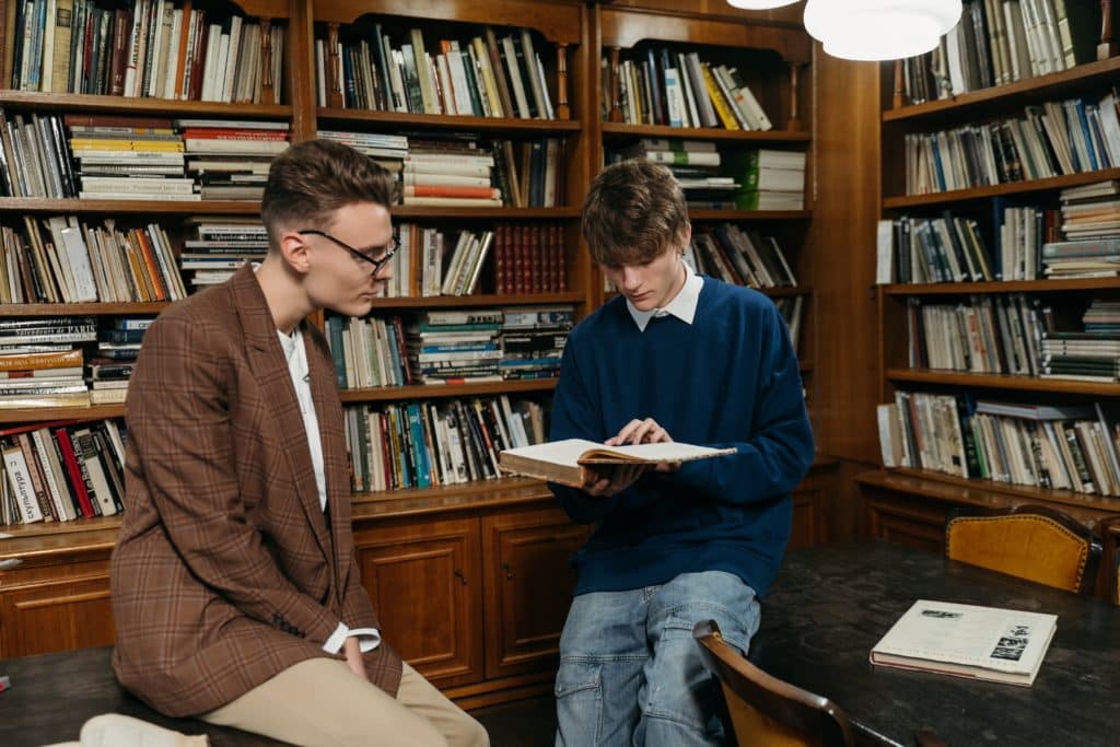 Two men studying in a library