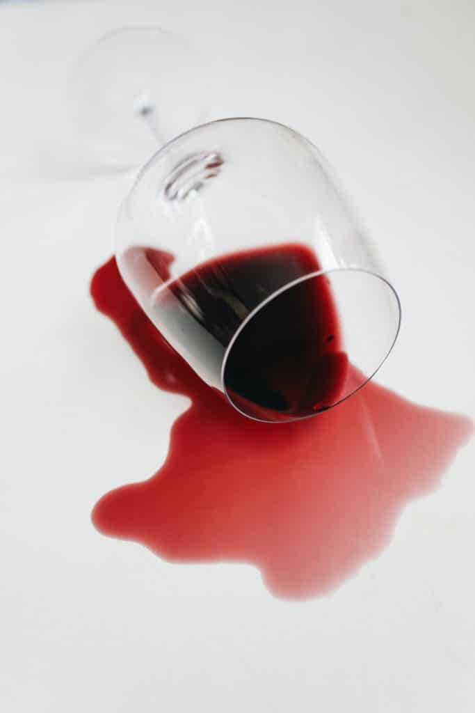 Red wine spilling out of a glass
