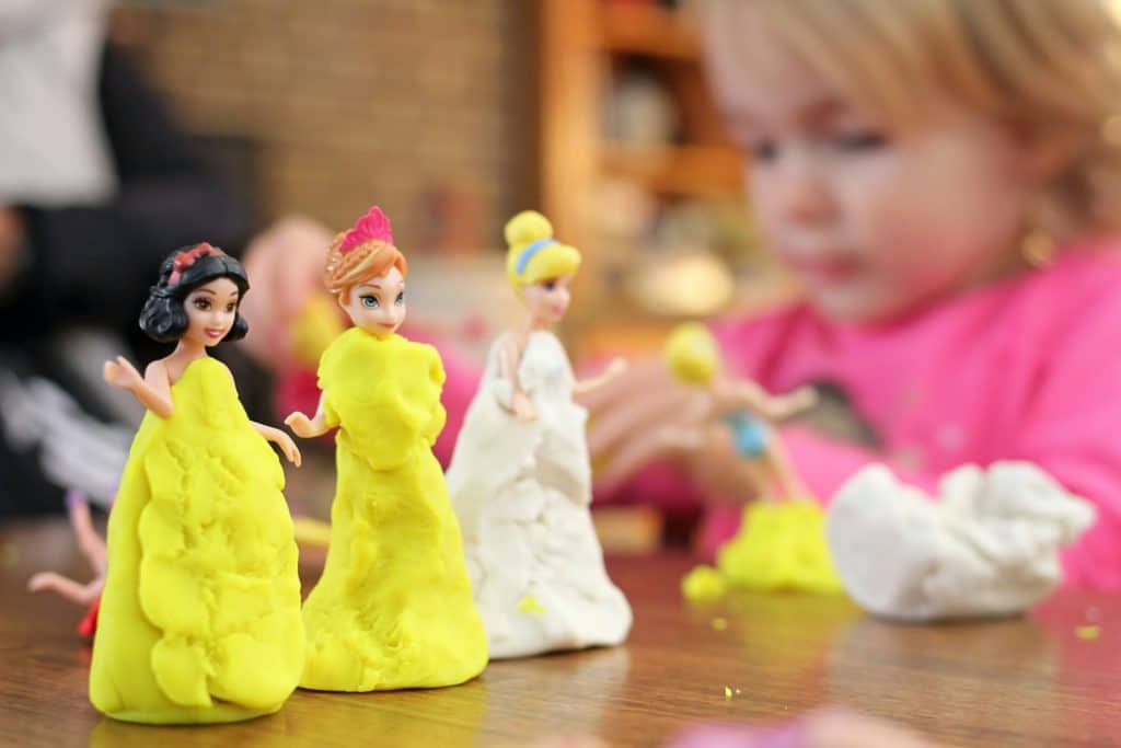 Disney princess figurines covered in clay