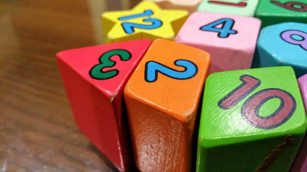 Various numbers on colorful diamond-shaped blocks