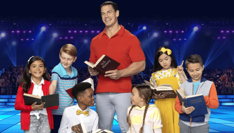 Promo image of host John Cena surrounded by kids on the set of Are You Smarter Than a Fifth Grader? 