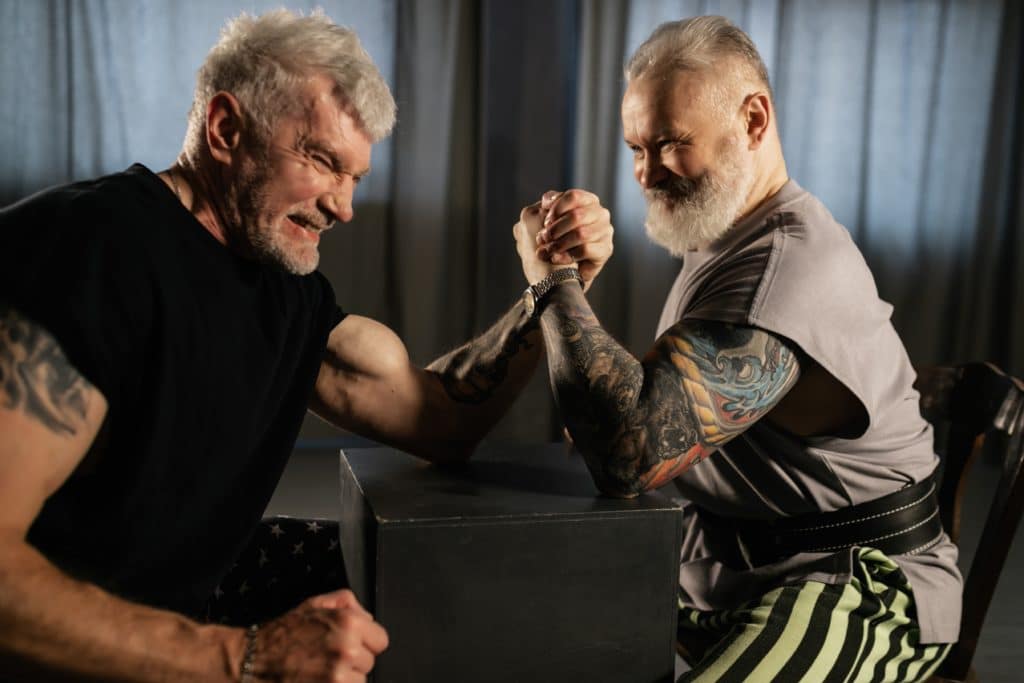 Elderly Men Doing an Arm-Wrestling Match