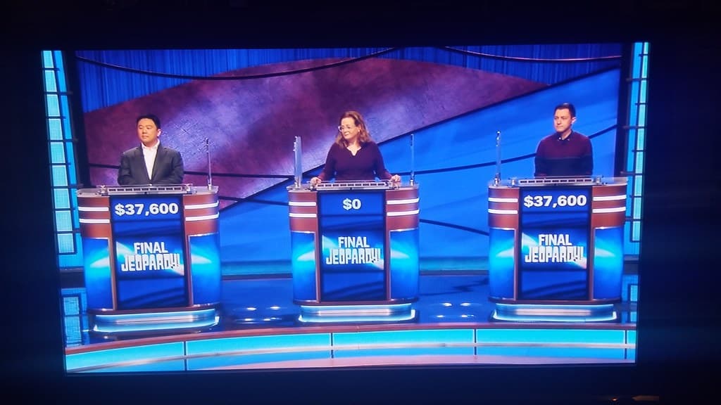 Contestants in a round of Final Jeopardy