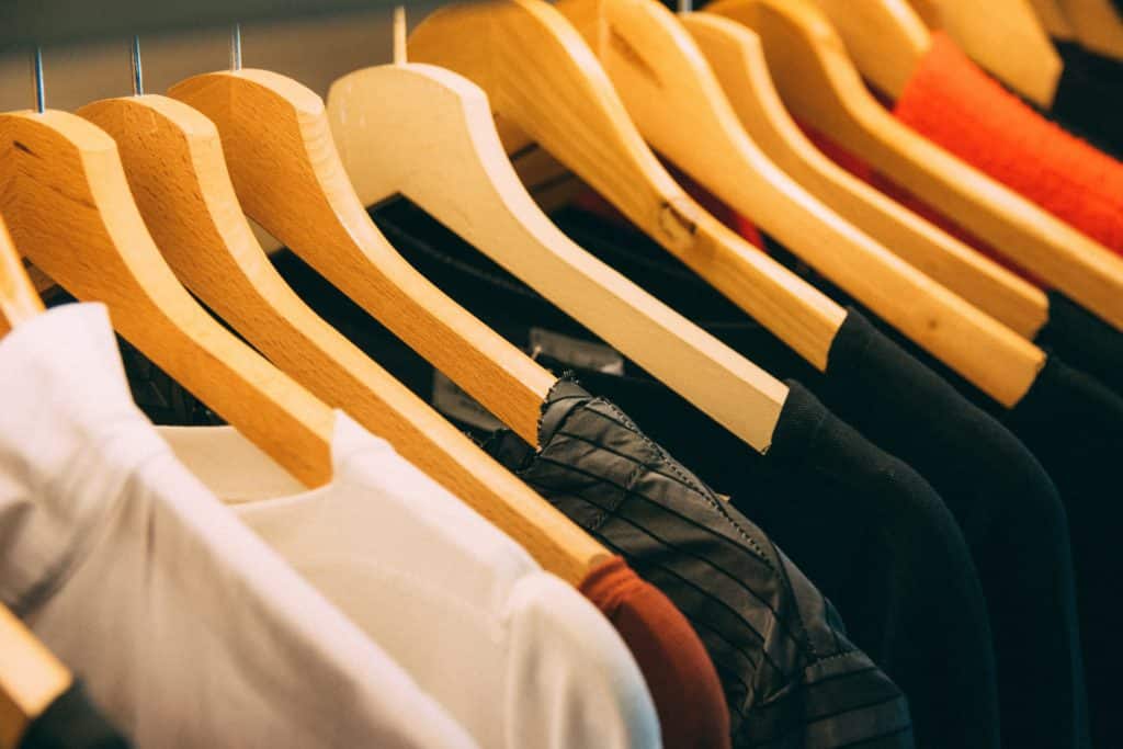 A row of t-shirts on hangers