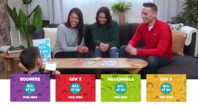 Promo photo of a family playing the All of Us trivia game