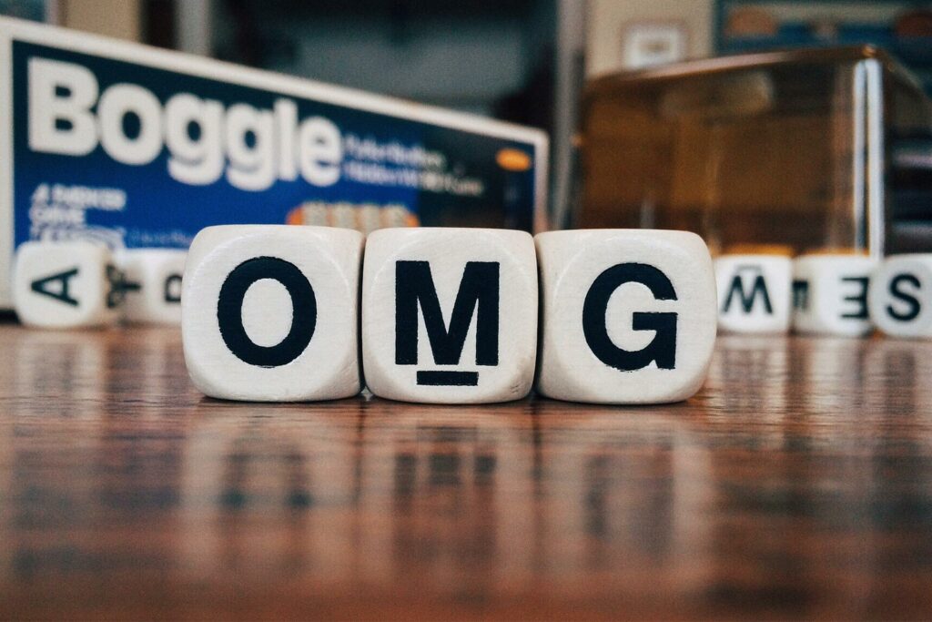 Boggle letters spelling out "OMG"