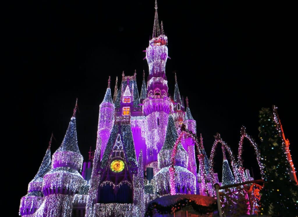 Disneyworld Magic Kingdom castle lit up at night