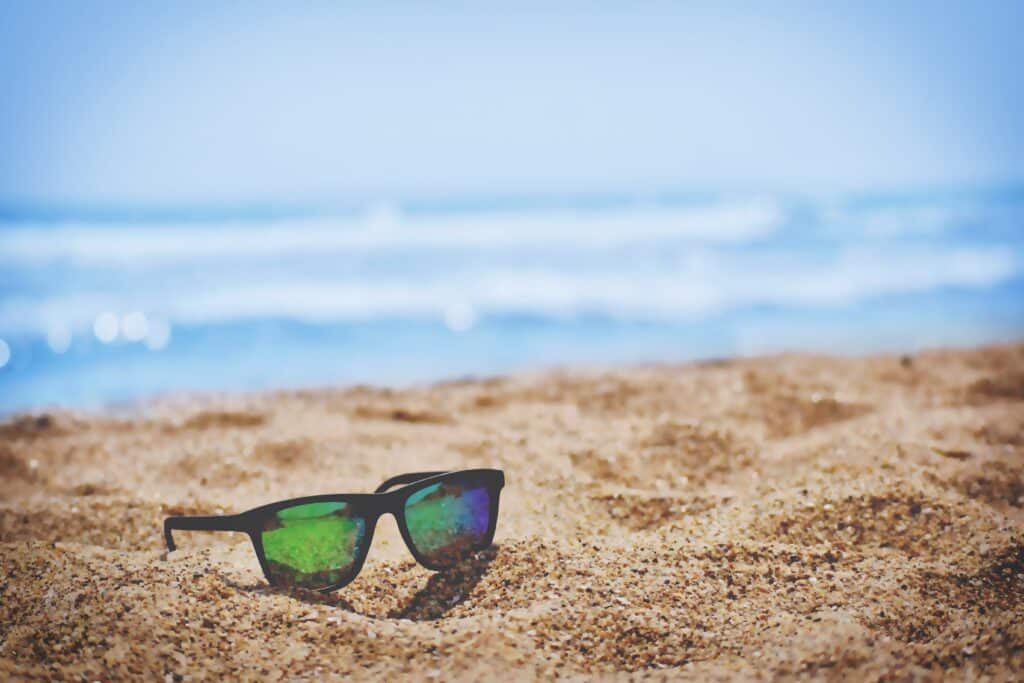 Sunglasses on the sand of a beach