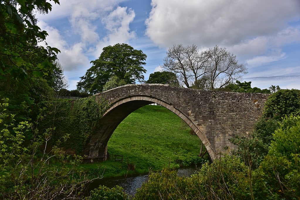 Photo of the Brig o' Doon, a medieval bridge in Robert Burns's home village of Alloway, Scotland, which formed part of the setting of his poem "Tam o' Shanter."
