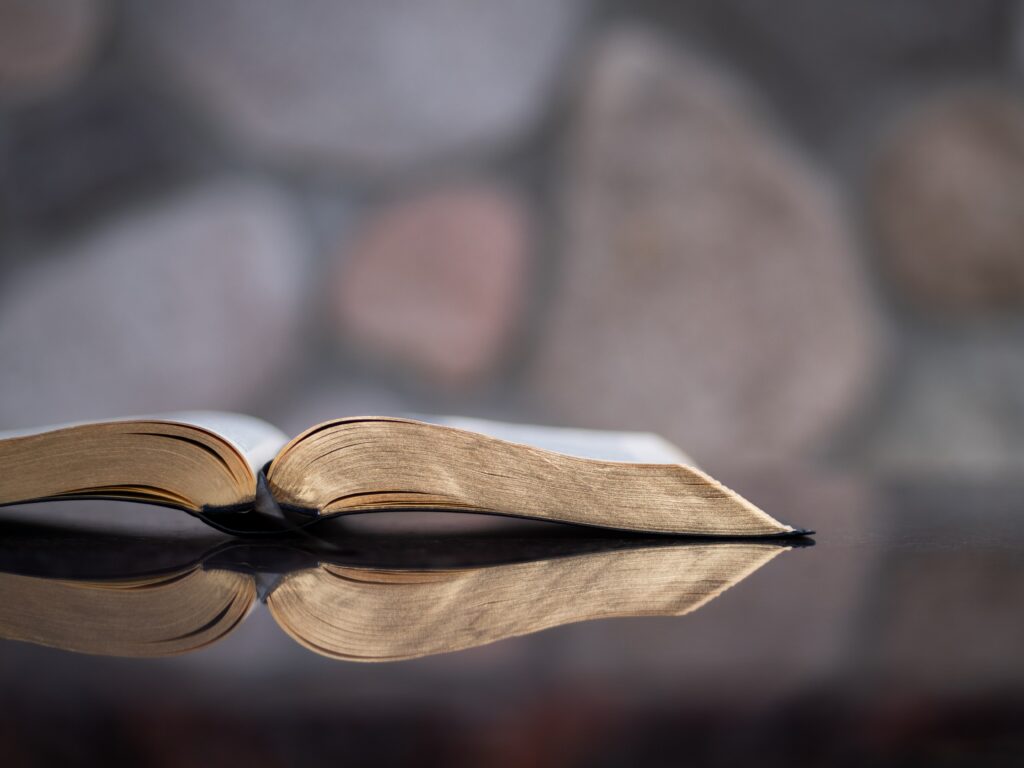 Photo of an open Bible on a surface