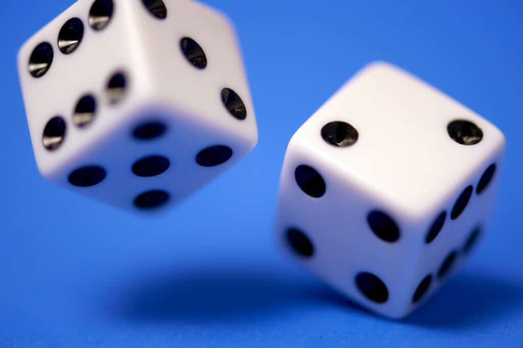 A pair of dice against a blue background