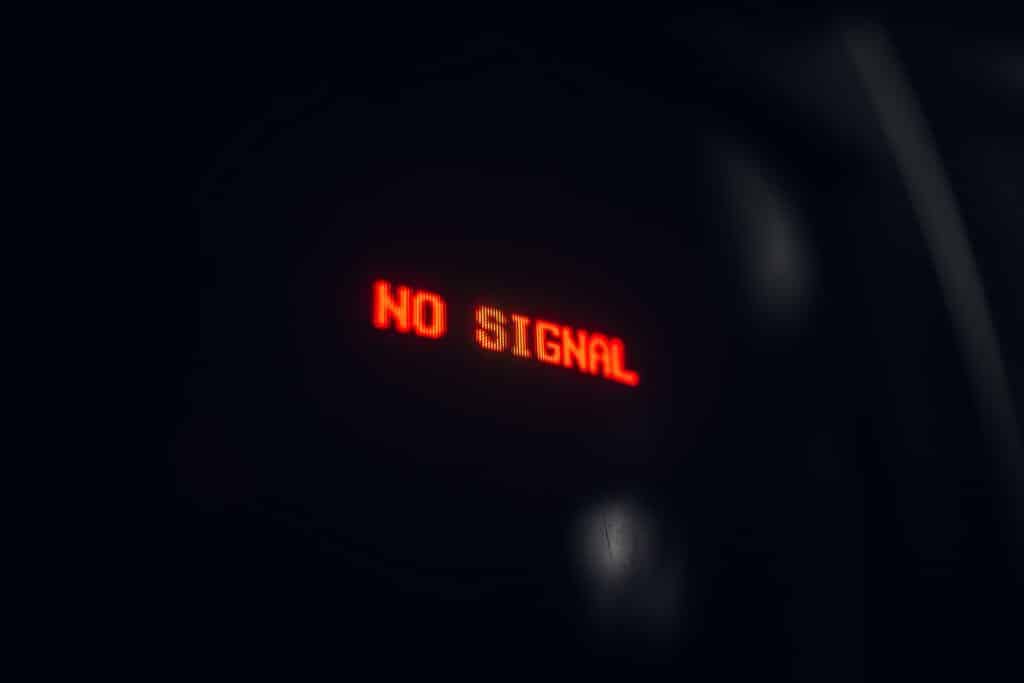 A black screen that reads "No Signal" in red, digital letters