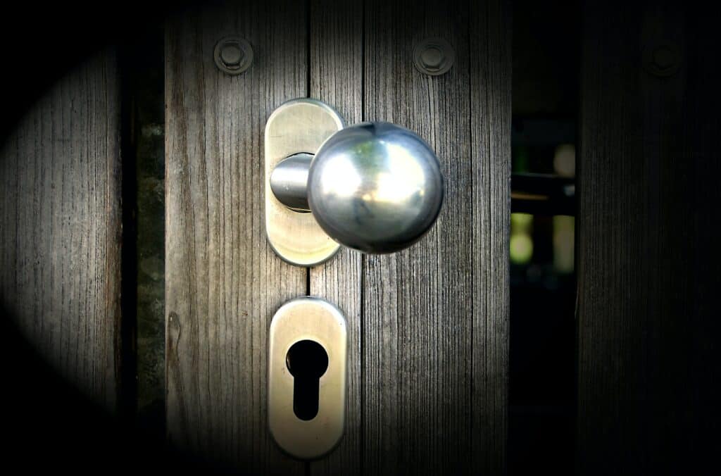 Photo of a Silver Door Knob and Deadbolt
