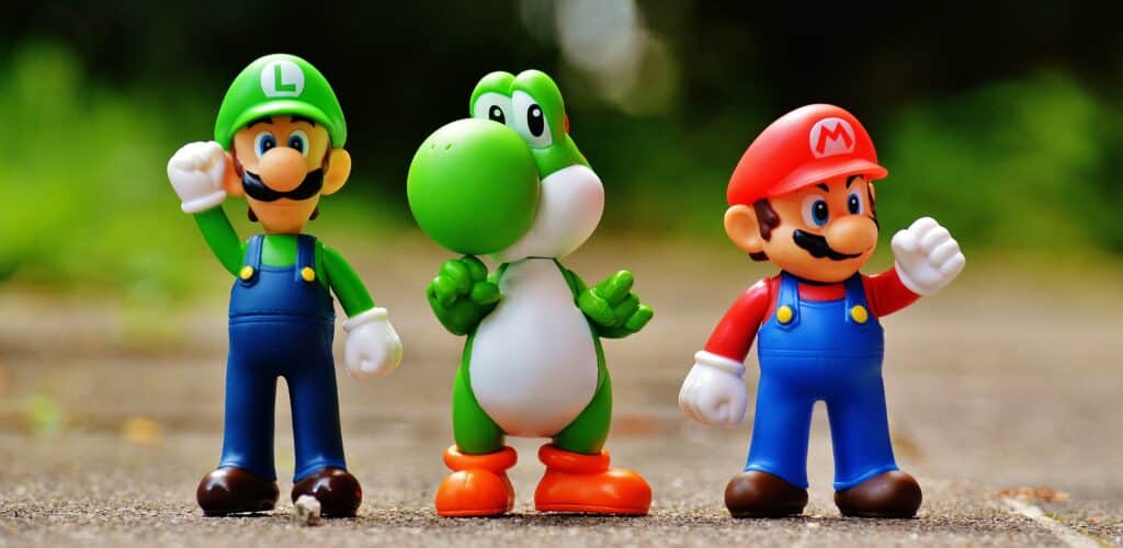 Photo of Luigi, Yoshi, and Mario figurines.
