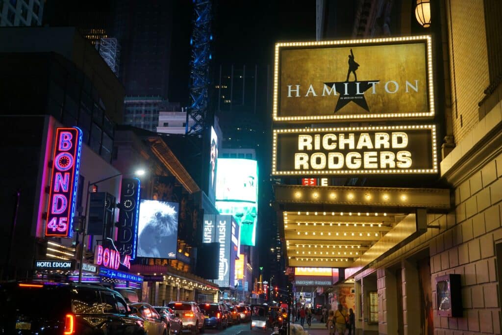Photo of a billboard for Hamilton outside a Broadway theater