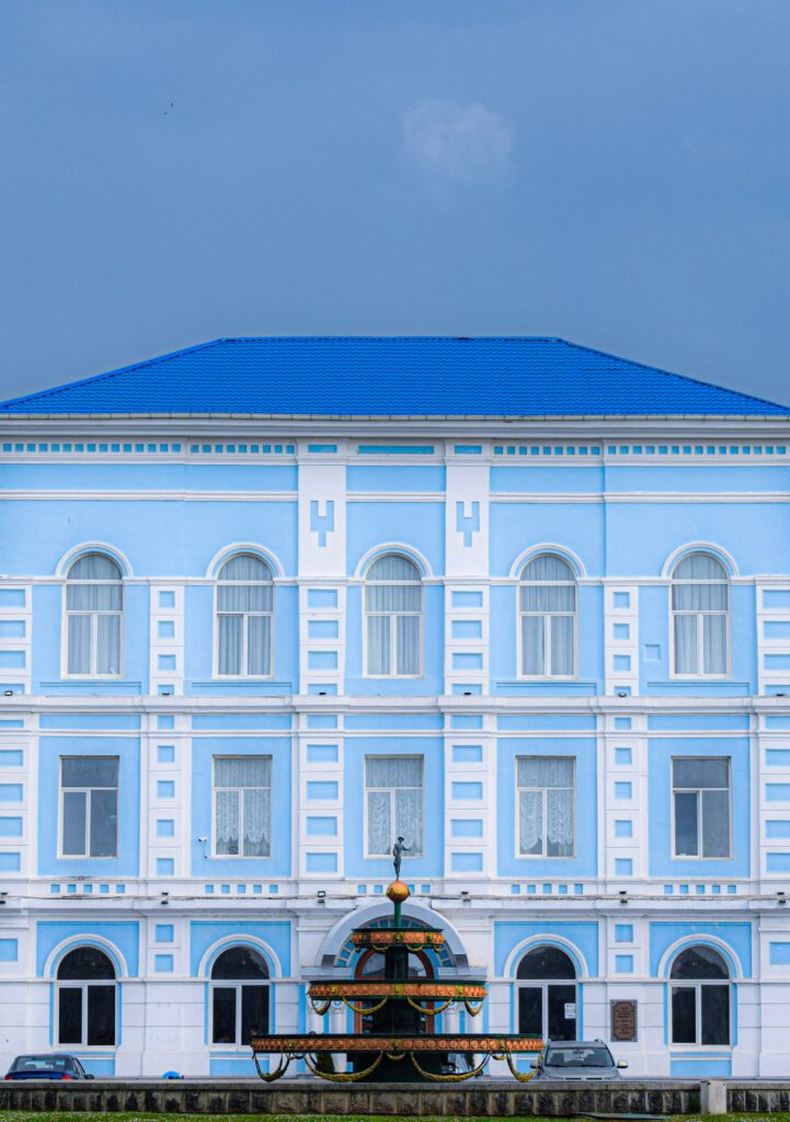 Photo of a blue building against a blue sky
