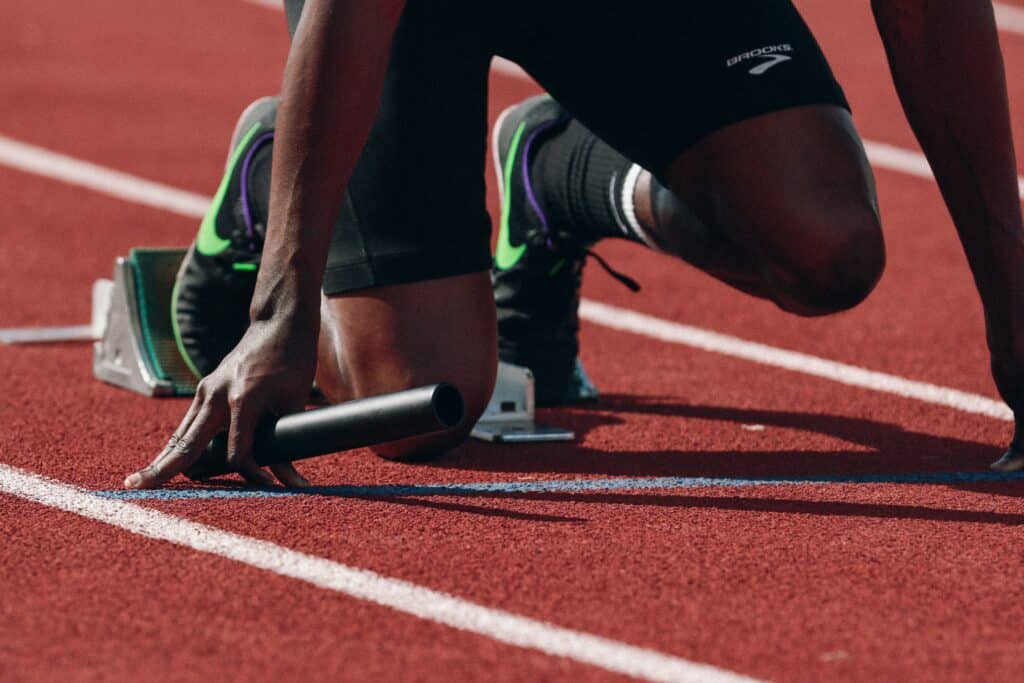 Runner in starting position on a track