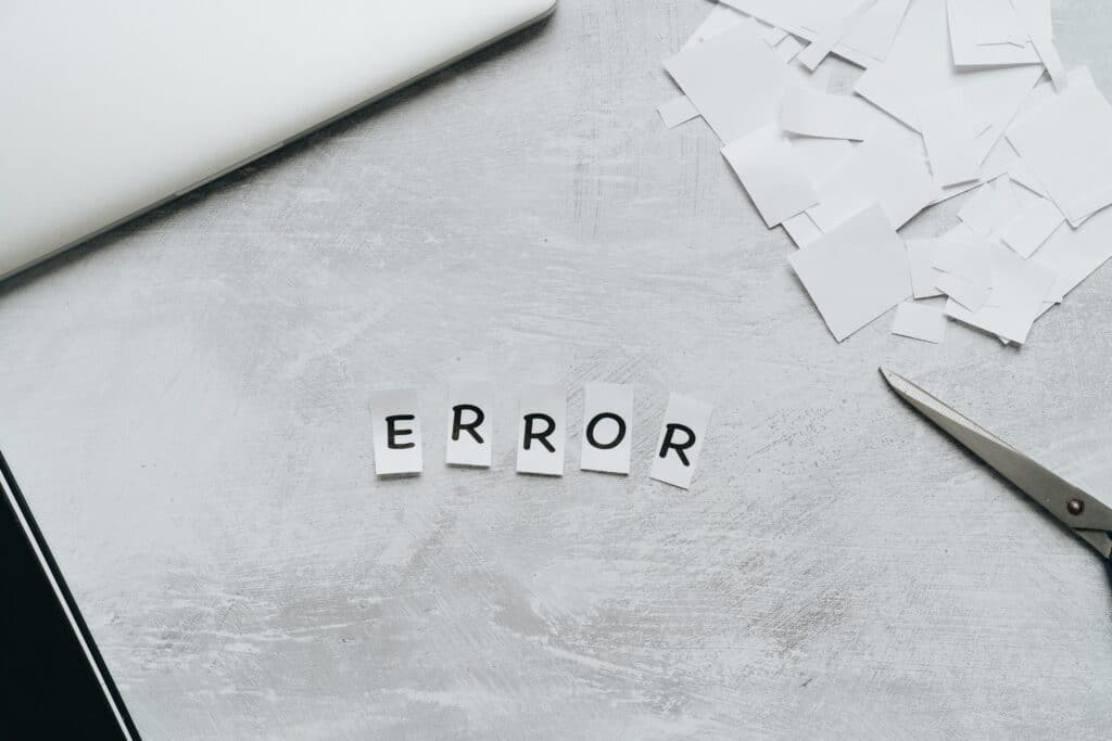 Pieces of paper spelling out the word "ERROR"