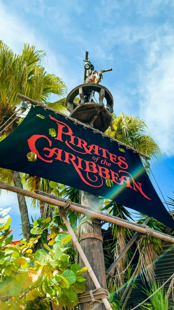 Photo of the sign and decor at the entrance to the Pirates of the Caribbean ride at Disney World in Orlando, FL.