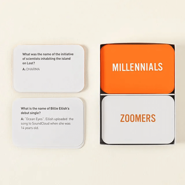 Orange and white Millennials vs. Zoomers trivia cards against a cream-colored background