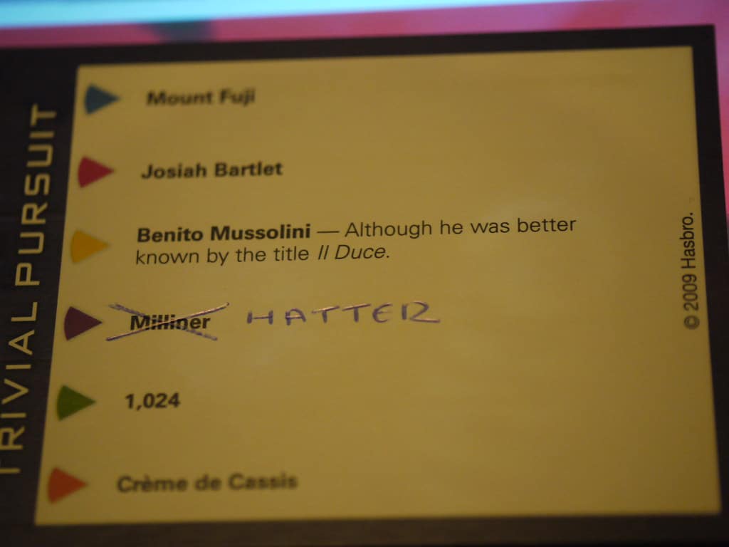 Photo of a Trivial Pursuit answer card, with an answer that says "Milliner" crossed out and "Hatter" written next to it.