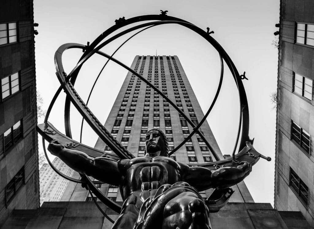 Black and white photo of the Atlas statue outside 30 Rockefeller Plaza, NYC.