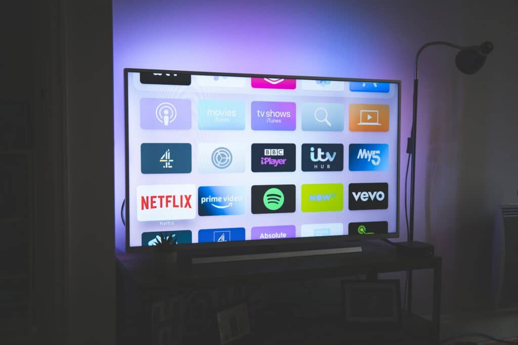 Photo of a large screen TV displaying various streaming apps. 