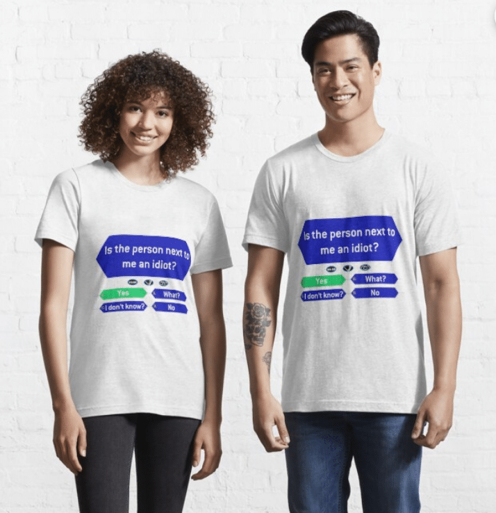 Photo of a man and woman posing against a white brick wall. They are both wearing white t-shirts with a question on it in the style of "Who Wants to Be a Millionaire" that reads "Is the person next to me an idiot?" "Yes" "What?" "I don't know?" "No"
