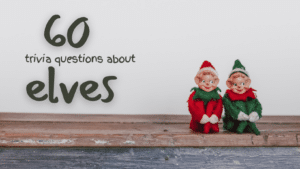 Photo of two Christmas elf decorations sitting on a wooden shelf, with green text next to it that reads "60 trivia questions about elves"