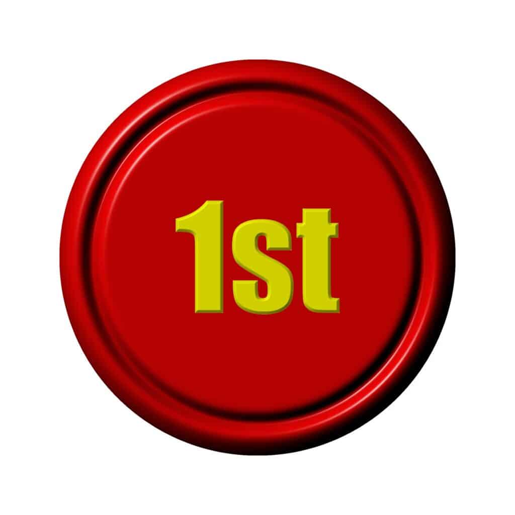 Illustration of a red button with yellow text on it that reads "1st"