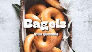 Photo of a basket of bagels atop a stone counter. White text above it reads "Bagels Trivia Questions"