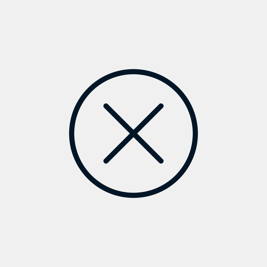 Photo of a black and white delete icon (an X in a circle) against a light grey background