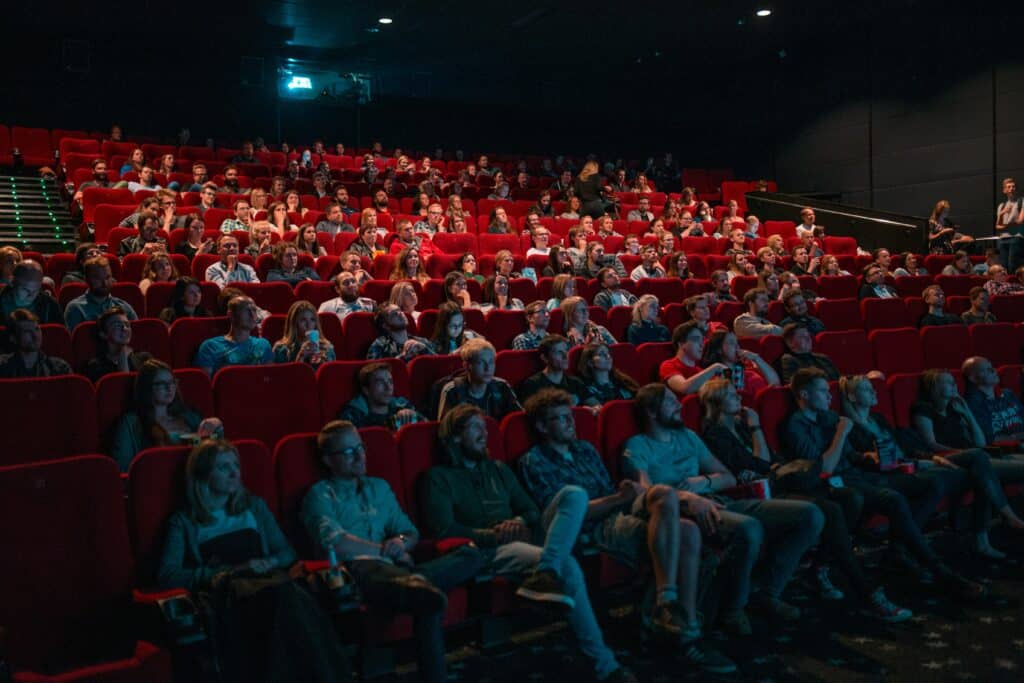 Photo of the audience inside a crowded movie theater.