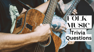 Photo of two people, one playing a guitar and the other playing a banjo, with white and black text over it that reads "Folk Music Trivia Questions"